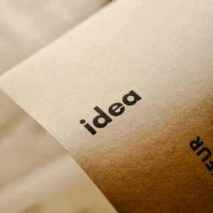 Close-up shot of the word 'idea' printed on brown paper, perfect for representing creativity and startups.